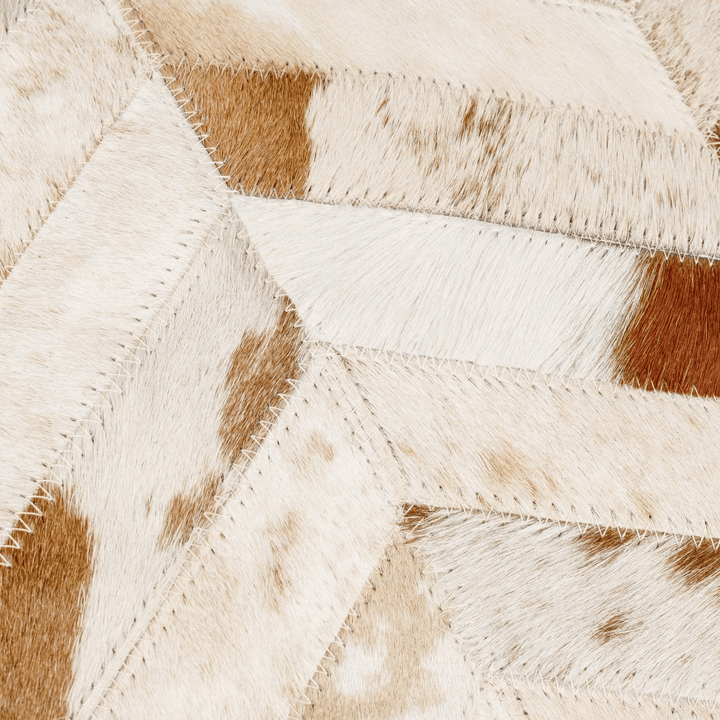 Close-up of a pillow with brown and beige colors.