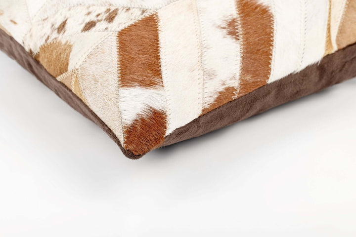 Close-up of a brown and white patterned pillow on a white background