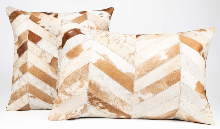 Two decorative pillows with brown and white chevron pattern on a light gray background