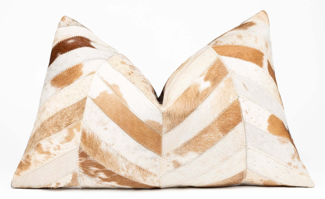 Decorative pillow with brown and beige chevron pattern on a white background