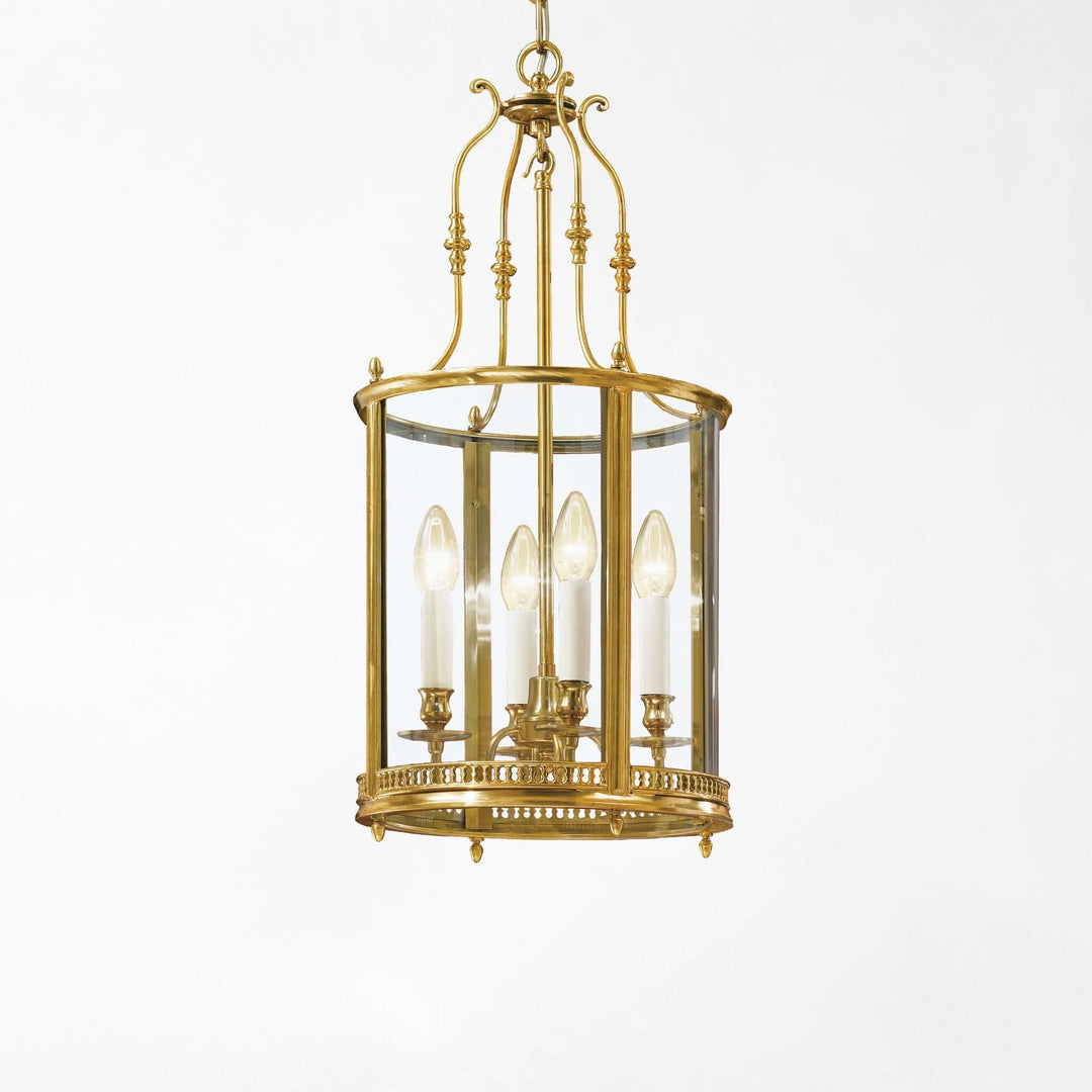 Brass chandelier with clear glass on a white background