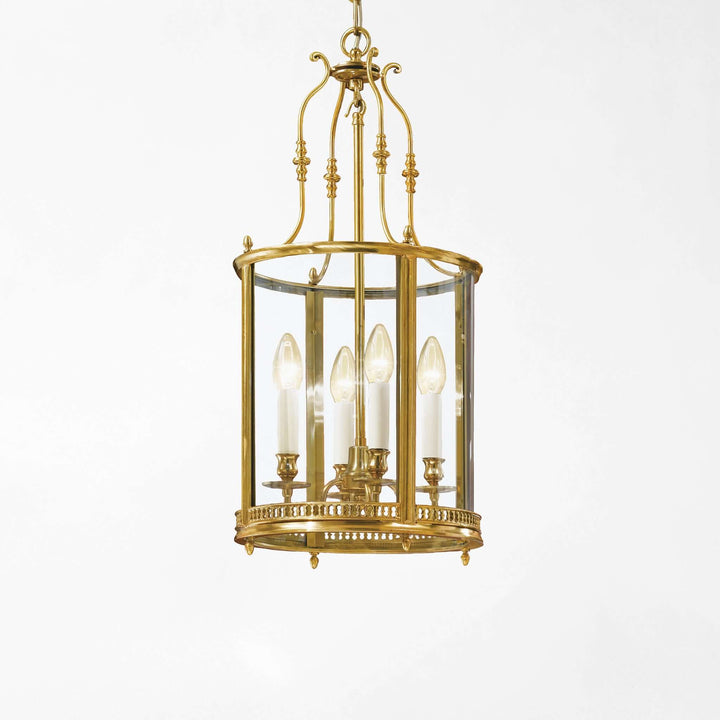 Brass chandelier with clear glass on a white background