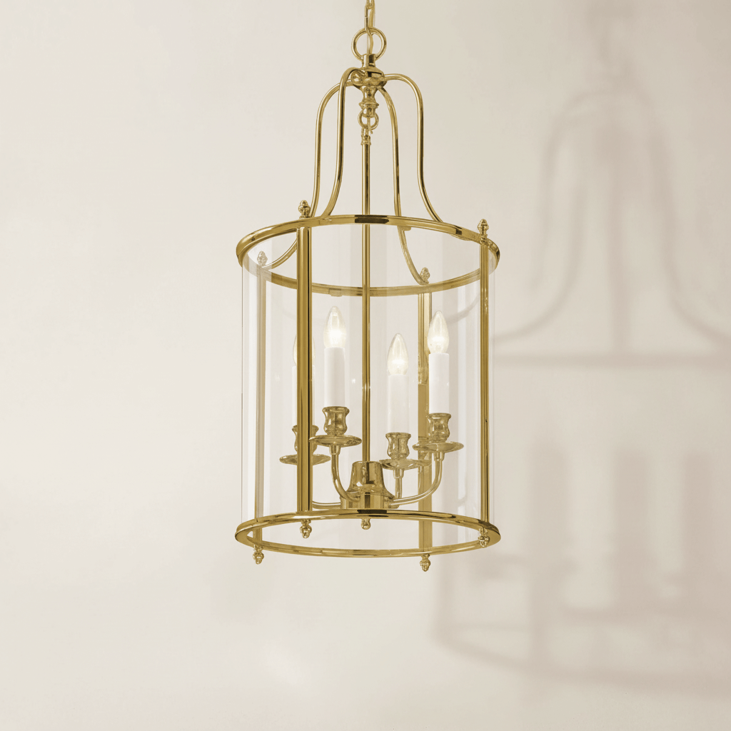 Gold pendant light fixture on a beige background
