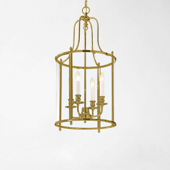 Brass lantern-style chandelier on a white background