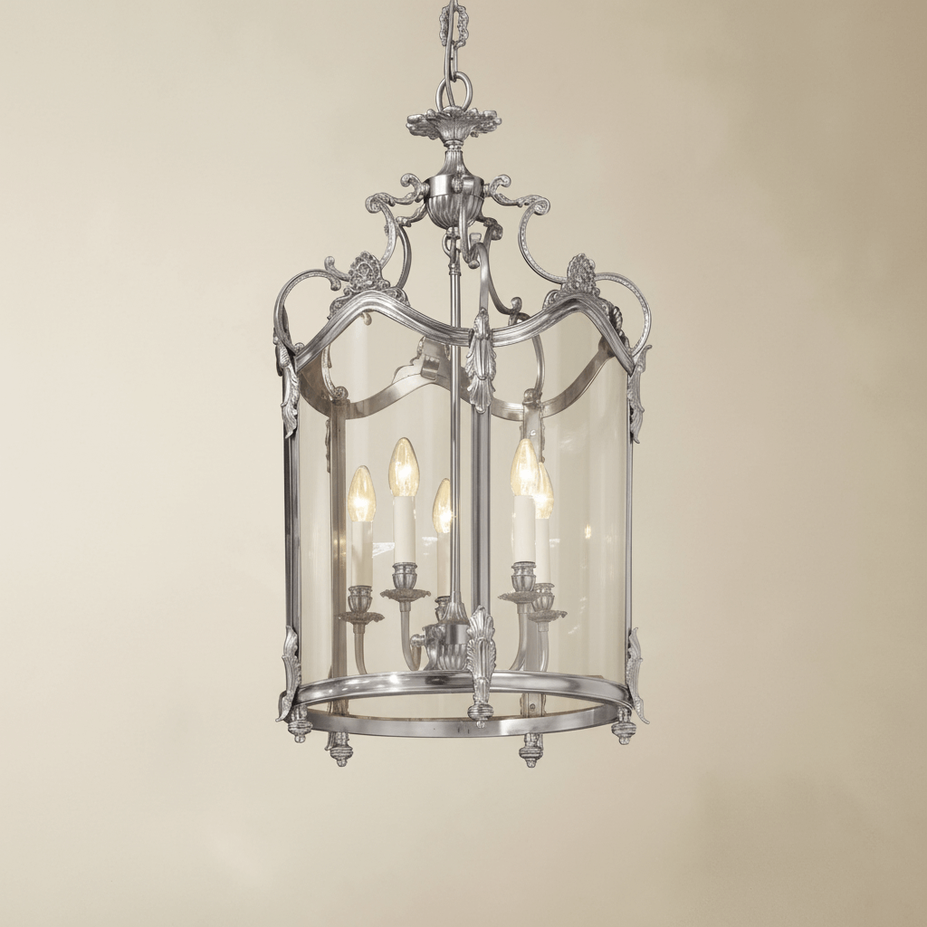 Decorative silver chandelier light fixture on a beige background
