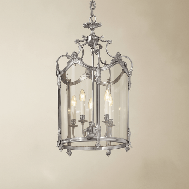 Decorative silver chandelier light fixture on a beige background