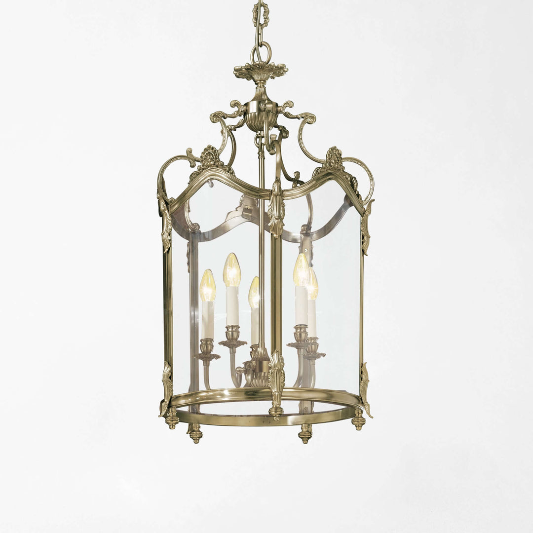 Decorative silver pendant light with clear glass panels on a white background