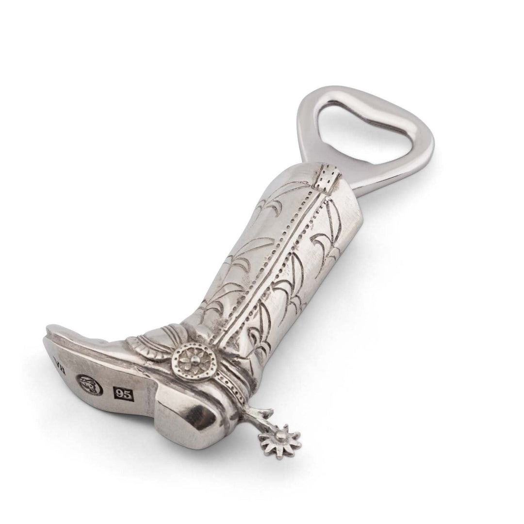 Decorative cowboy boot bottle opener with intricate designs on a white background