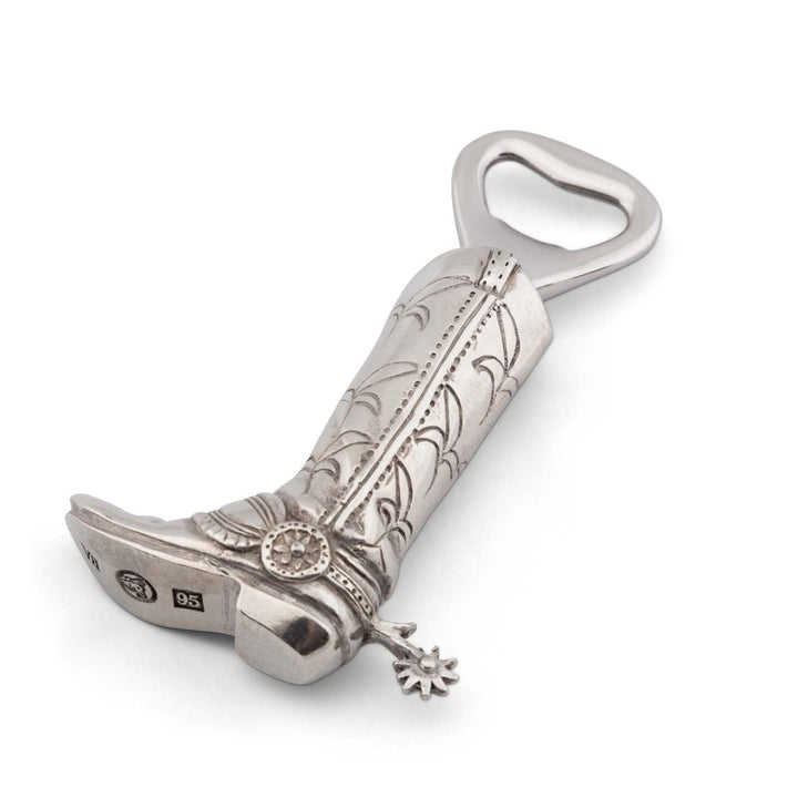 Decorative cowboy boot bottle opener with intricate designs on a white background