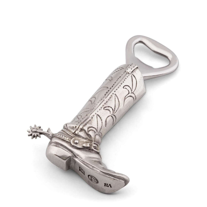 Decorative silver cowboy boot bottle opener on a white background