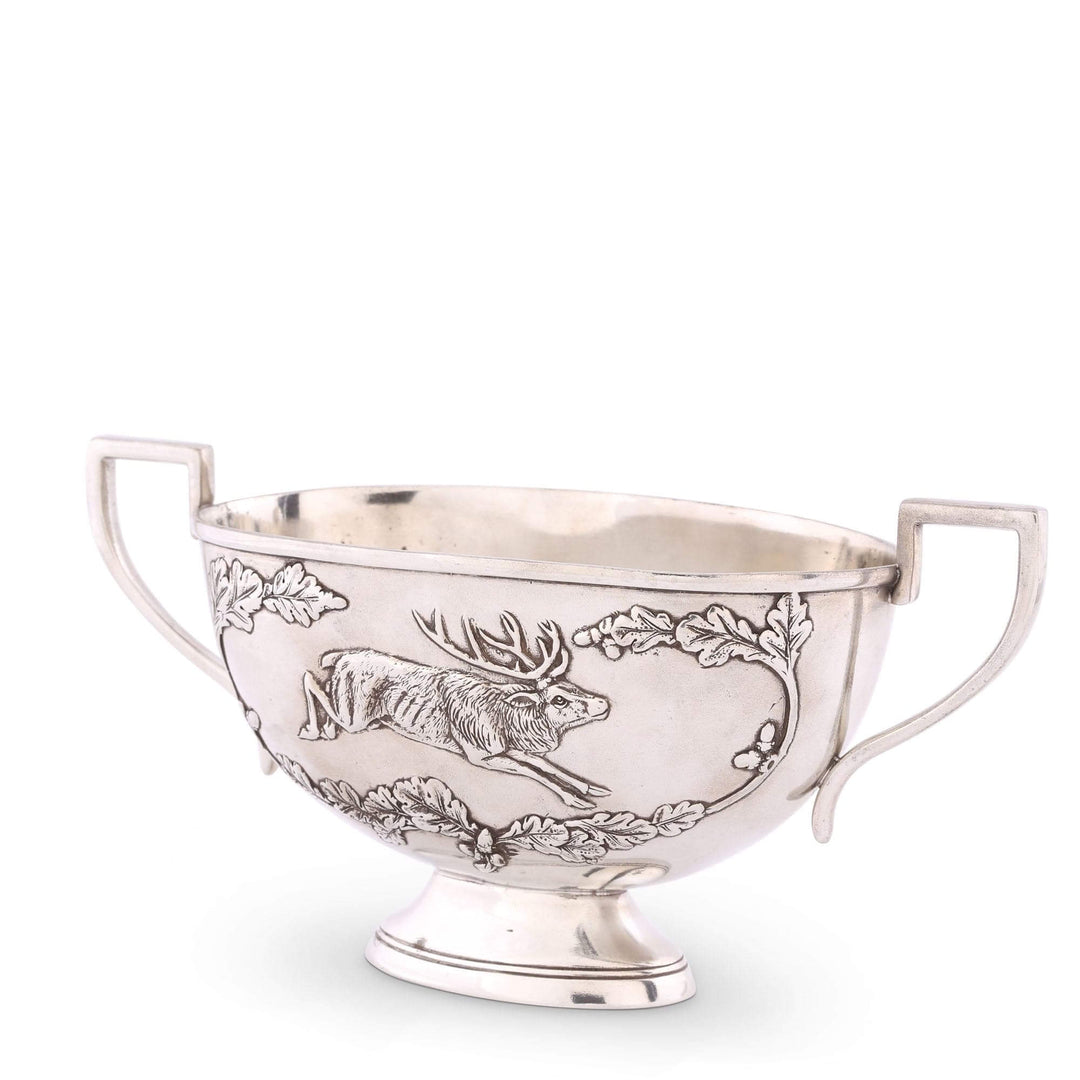 Silver bowl with engraved design on a white background