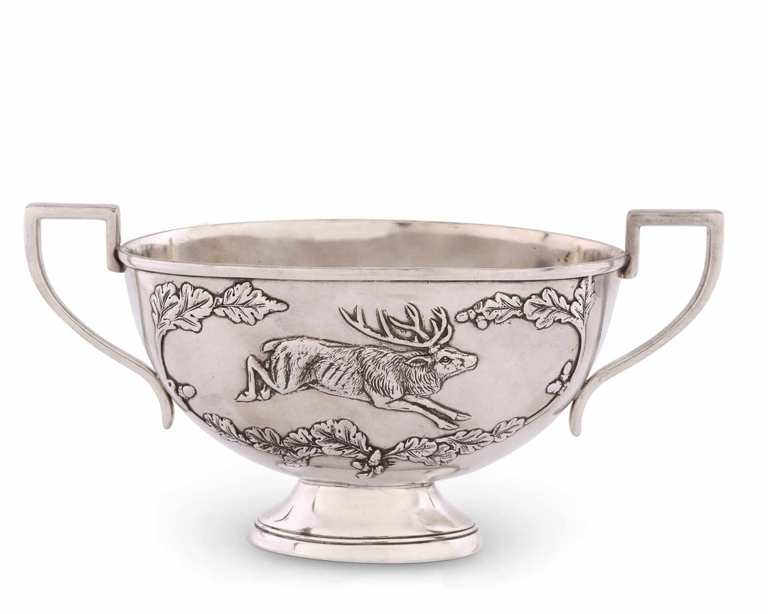 Silver bowl with a deer design on a white background