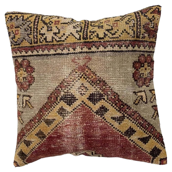 Decorative pillow with intricate geometric pattern on a white background