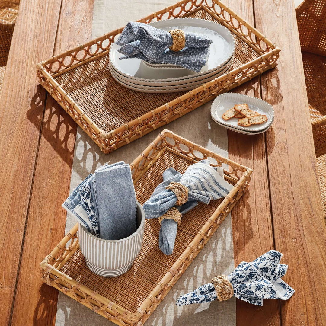Handwoven Vintage Rattan Trays for Serving and Display on table with plates, napkins and other decor