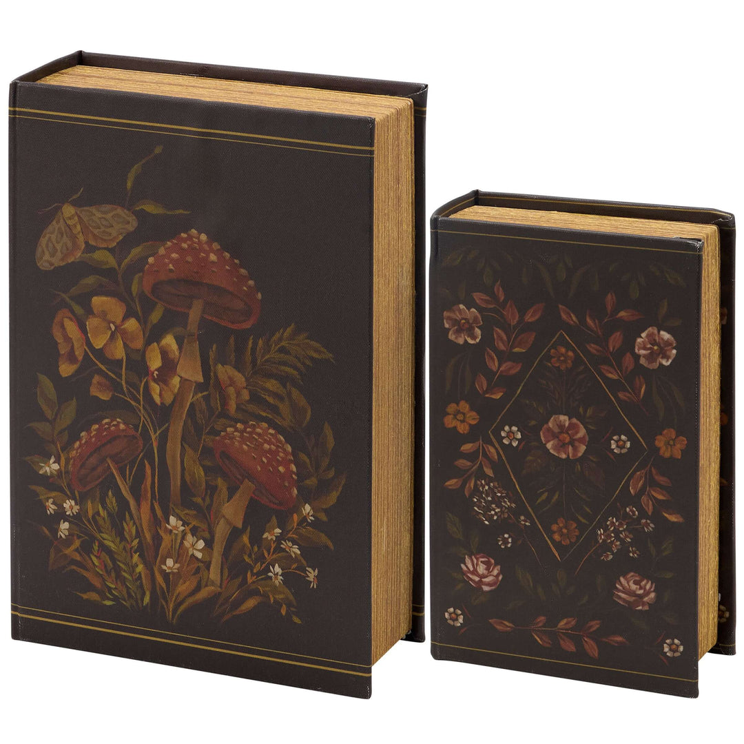 Two decorative books with floral and mushroom designs on a white background