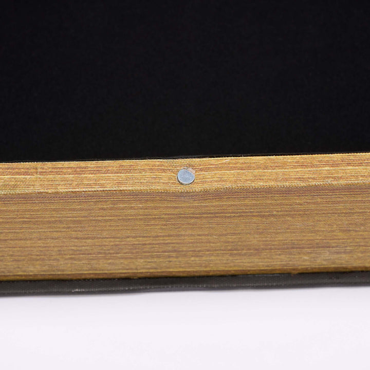 Wooden panel with a metal screw on a black and white background