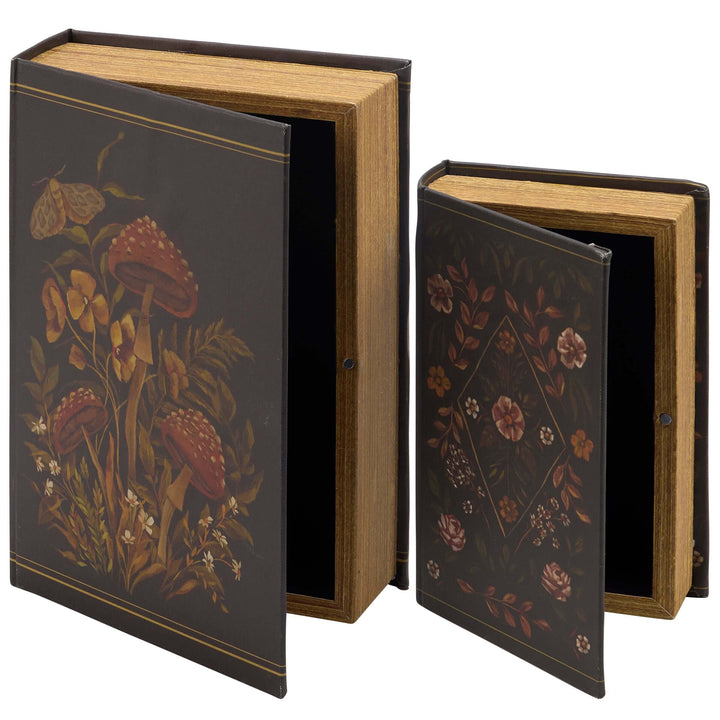 Two decorative books with floral designs on a white background