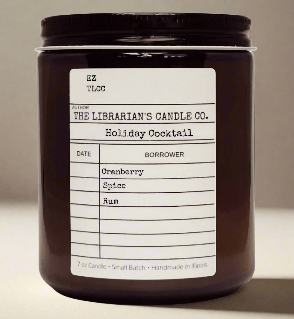 The Librarian's Candle Co. Holiday Cocktail featuring cranberry, spice, and rum in a vintage amber jar, Holiday Cocktail Scented Candle