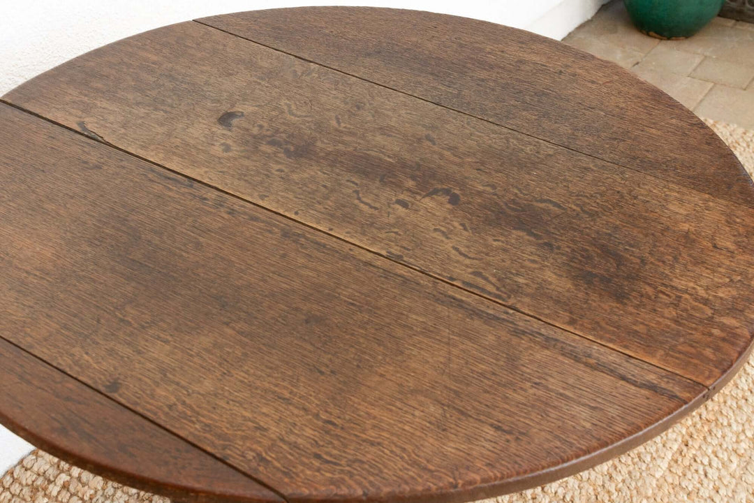 Round wooden table with a textured surface