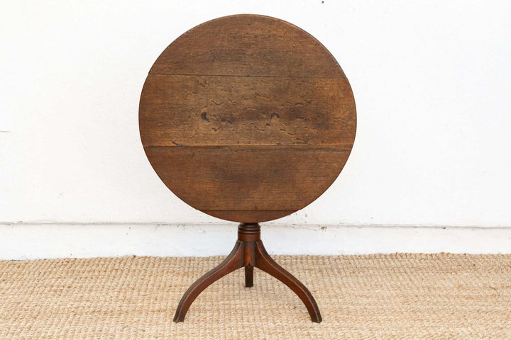 Round wooden table on a white background