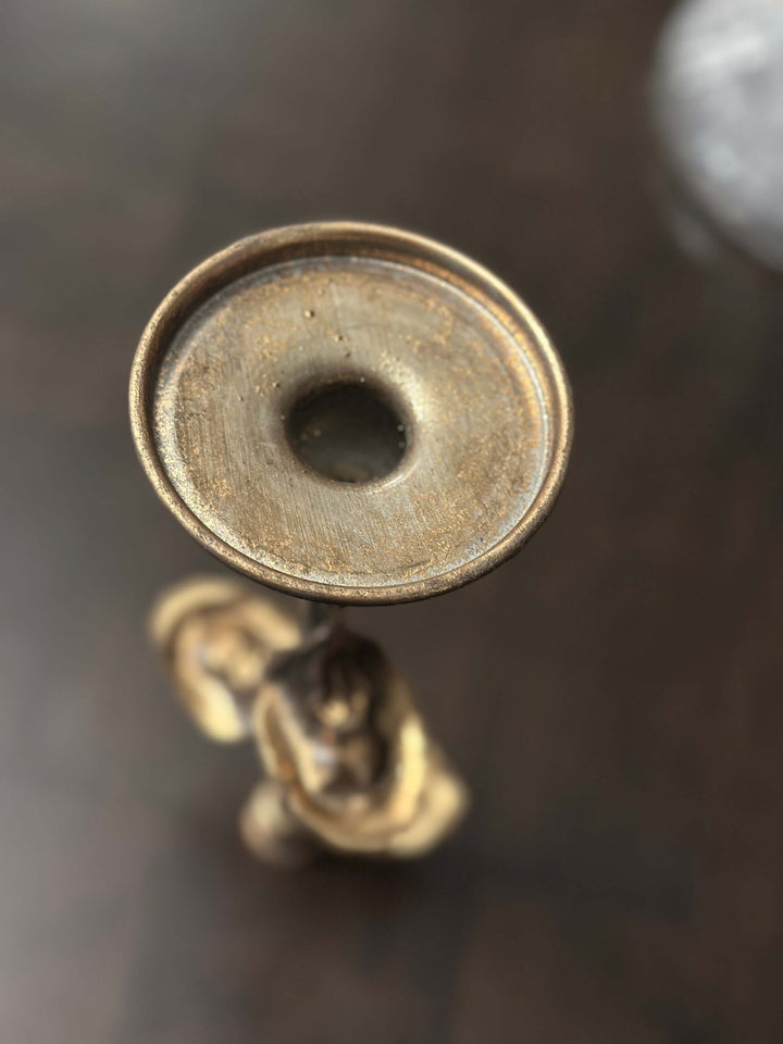 Antique brass leaf candle holder top view, showcasing vintage-inspired metal leaf design and elegant brass finish.