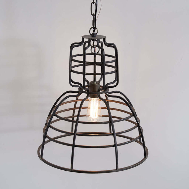 Industrial cage pendant light featuring a black metal design and exposed bulb, perfect for modern and rustic decor.