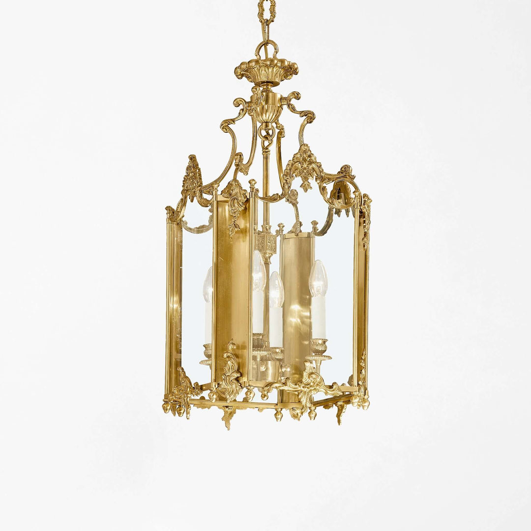 Ornate gold chandelier on a white background