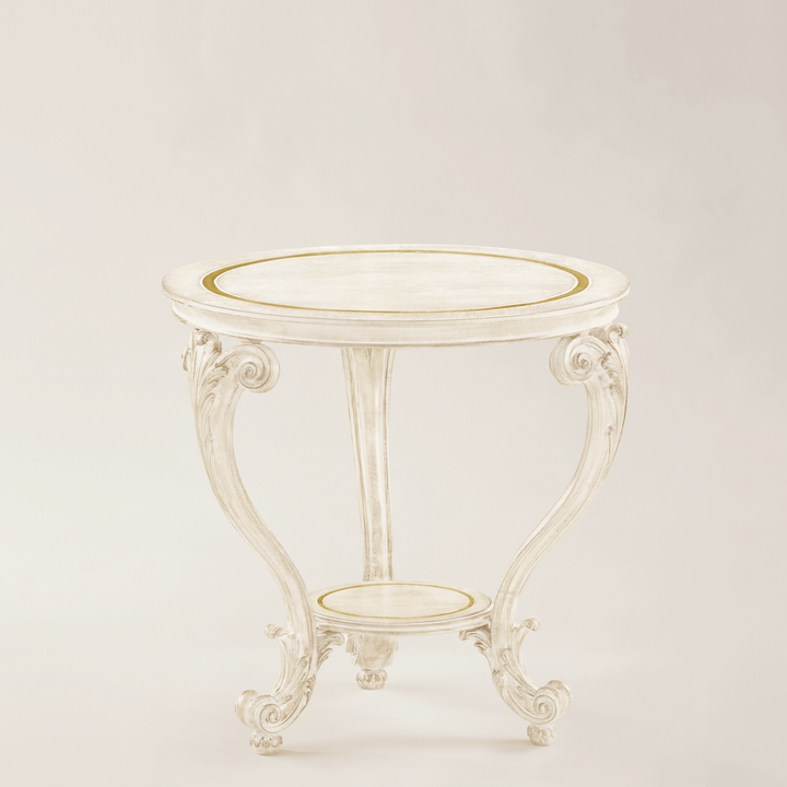 Small round table with decorative legs on a light beige background
