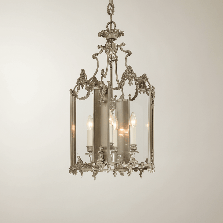 Decorative chandelier with intricate design on a plain background