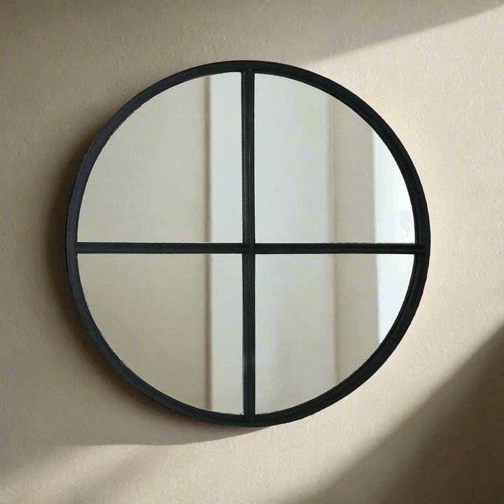Large round black wooden wall mirror with crossbar design, perfect for modern and industrial interior decor.