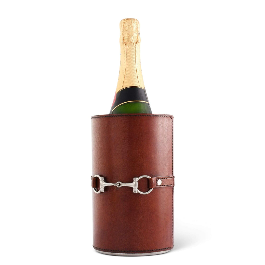 Bottle of champagne in a brown leather cooler with a silver buckle on a white background