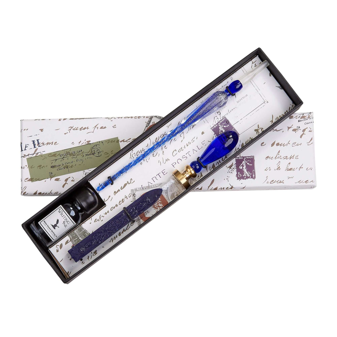 Blue ink pen set with ink bottle in a decorative box on a white background