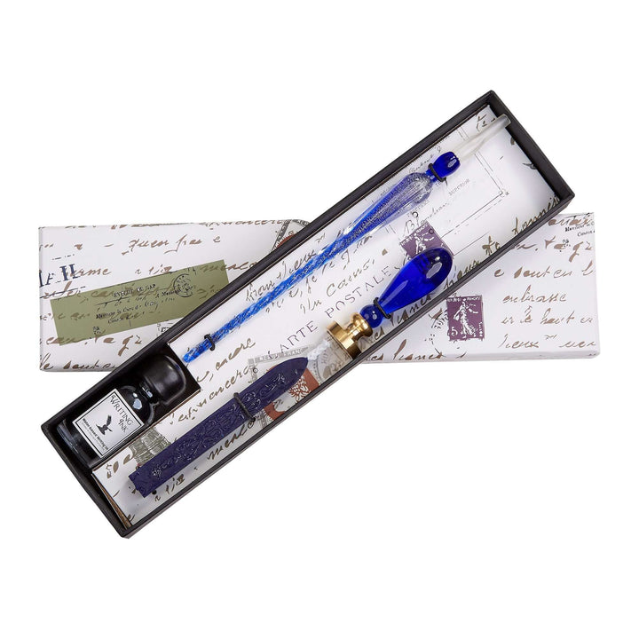 Blue ink pen set with ink bottle in a decorative box on a white background