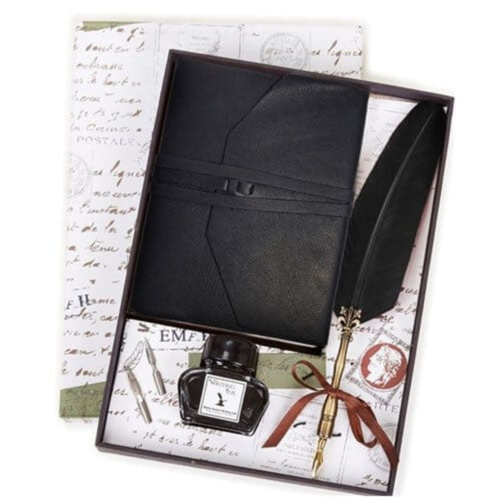 Black leather journal set with ink bottle and feather quill in a decorative box.