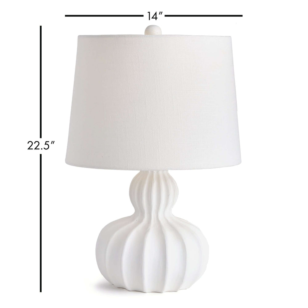 White carved wood table lamp with curved base and elegant fluted design, 22.5 inches tall, 14-inch shade.