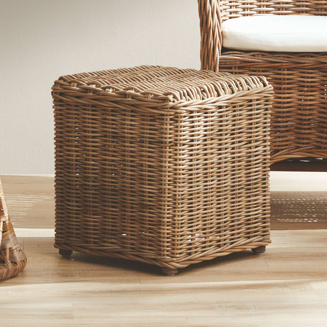 Kubu Rattan Side Table featuring a warm gray finish, perfect for coastal or bohemian home decor.