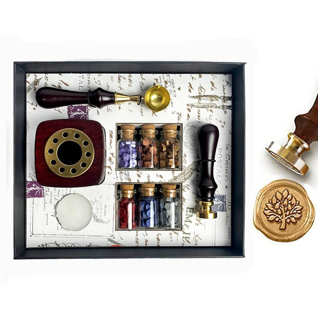 Wax sealing kit with stamp, ink pad, and small bottles on a decorative background