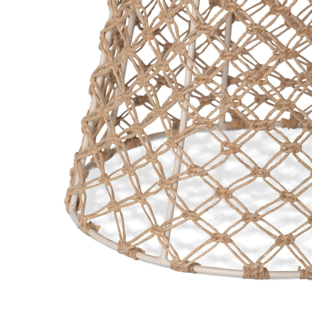 Close-up of a woven lampshade with a geometric pattern on a white background