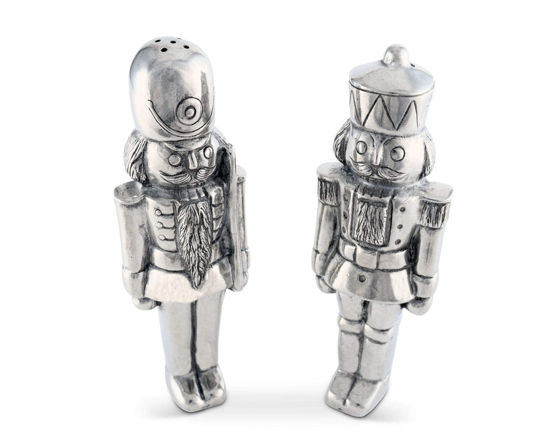 Silver nutcracker salt and pepper shakers on a white background
