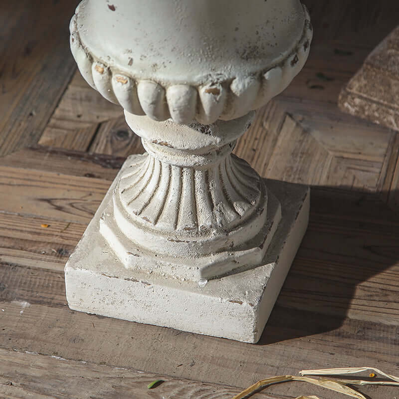 Decorative stone pedestal on a wooden surface