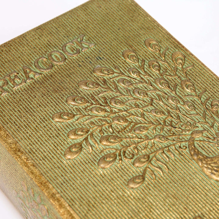 Close-up of a green textured object with intricate patterns and 'Baccarat' branding.