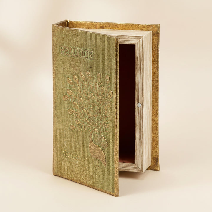 Decorative book-shaped storage box with peacock design on a white background
