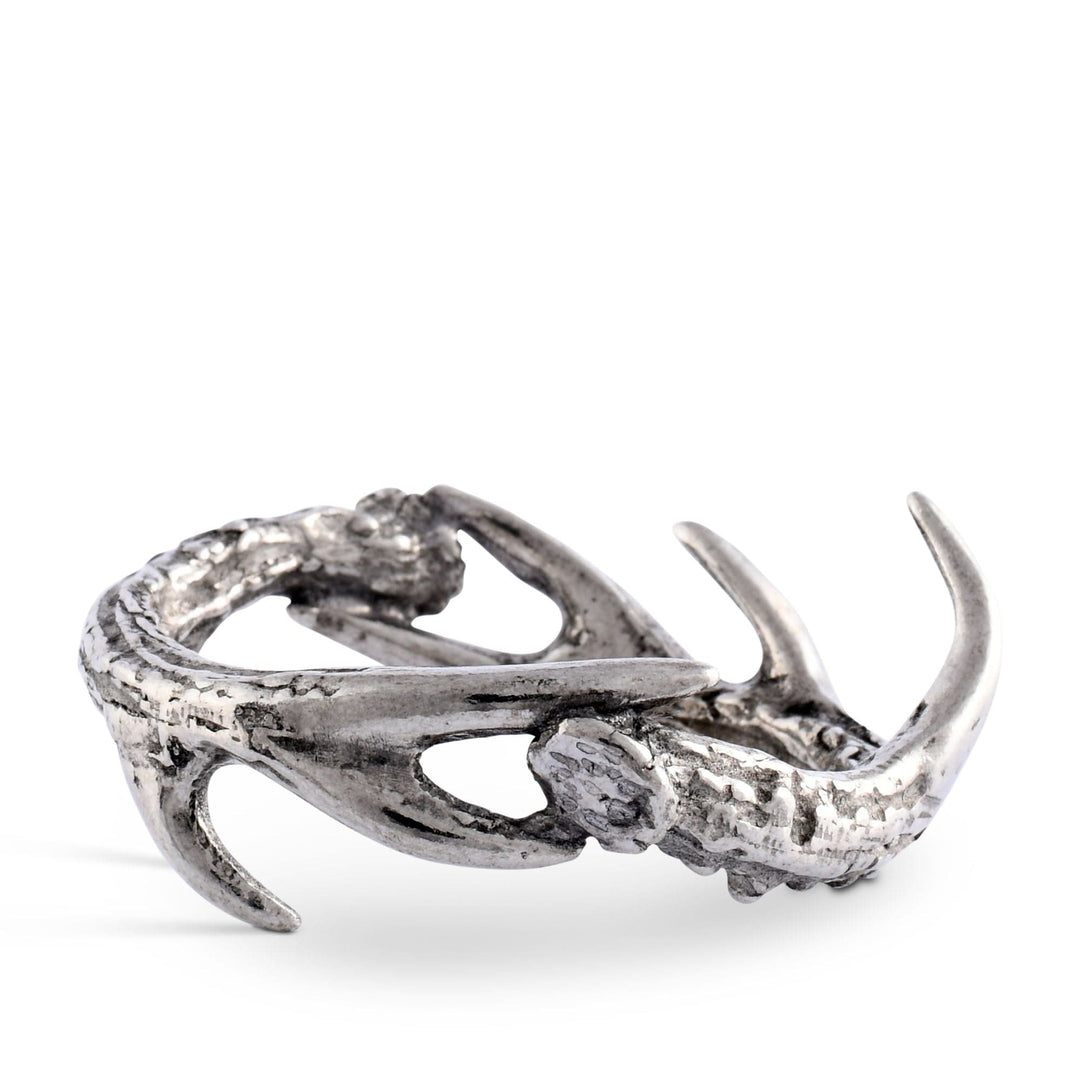 Silver antler-shaped napkin ring on a white background