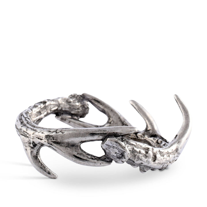 Silver antler-shaped napkin ring on a white background