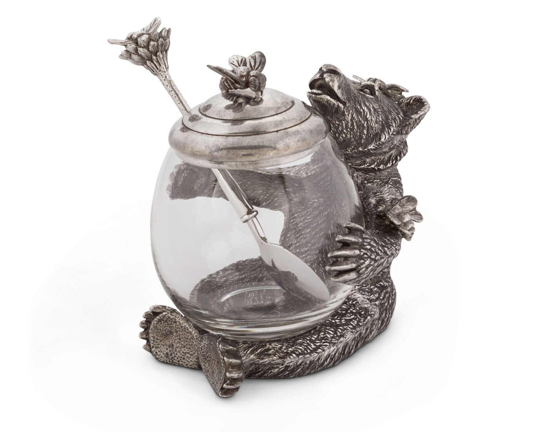 Decorative jar with a bear design on a white background
