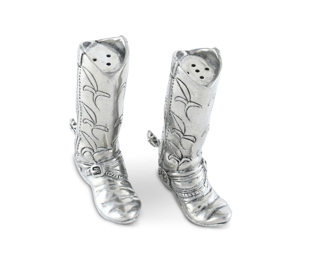 Silver cowboy boot-shaped pepper shakers on a white background