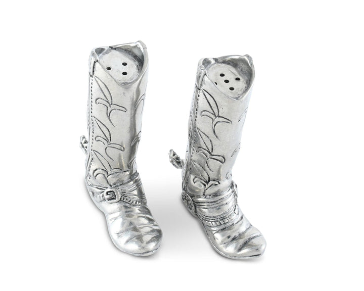 Silver cowboy boot-shaped pepper shakers on a white background