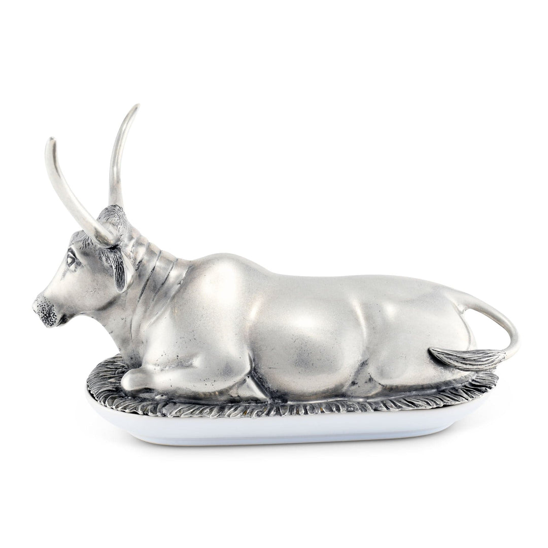 Silver bull figurine on a white background