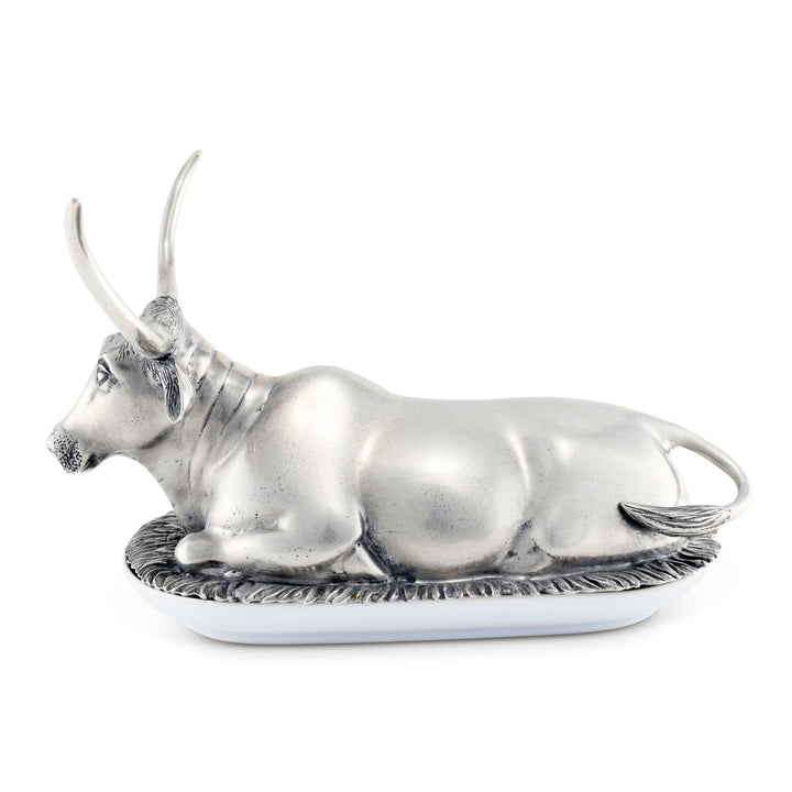 Silver bull figurine on a white background