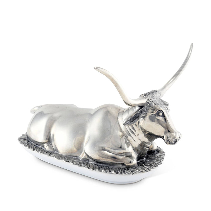 Silver bull figurine on a white background